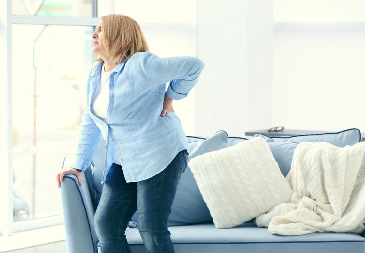 <span class="caption">Chronic back pain costs the UK economy £10 bn a year.</span> <span class="attribution"><a class="link " href="https://www.shutterstock.com/image-photo/senior-woman-suffering-backache-home-569871445?studio=1" rel="nofollow noopener" target="_blank" data-ylk="slk:Shutterstock;elm:context_link;itc:0;sec:content-canvas">Shutterstock</a></span>