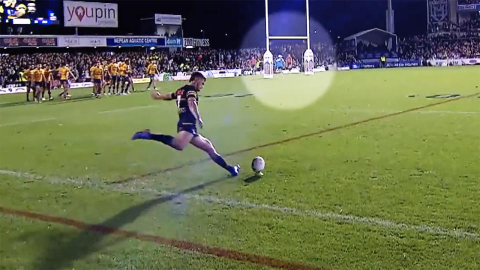 The Eels trainer, pictured here running in front of the posts while Nathan Cleary was kicking.