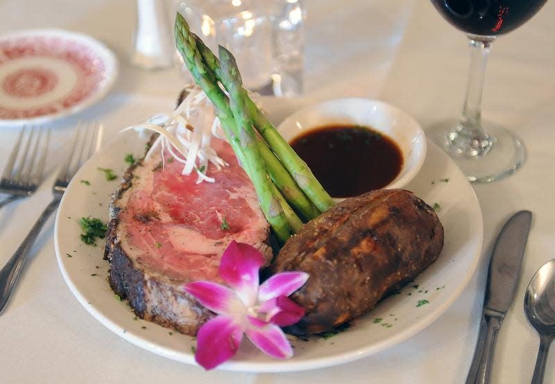 1776 Steakhouse, located in Midway Shopping Center at 18585 Highway One north of Rehoboth Beach, offers a prime rib with au jus dinner, served with fresh asparagus and a baked potato.