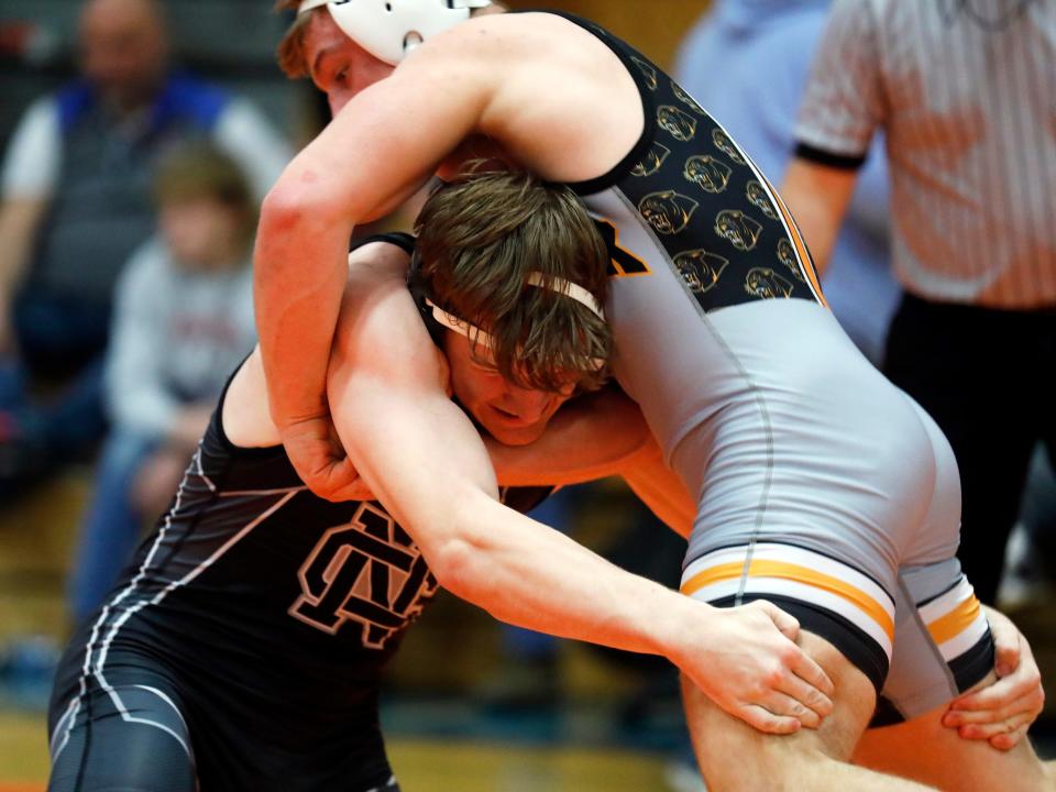 Newark Catholic's Brendan Sheehan takes a shot on New Lexington's Hunter Rose during the finals at 165 pounds during the Licking Valley Invitational on Saturday, Jan. 7, 2023, in Hanover, Ohio.