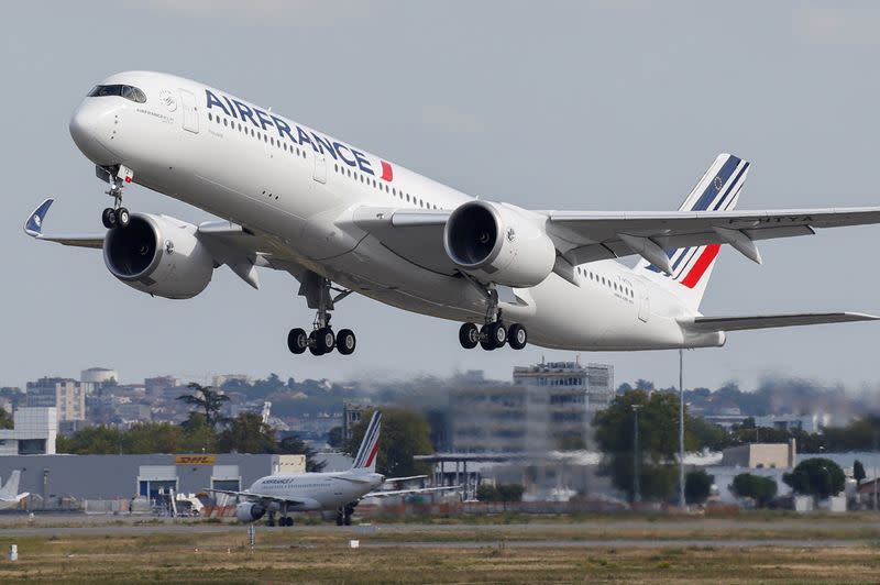 FILE PHOTO: The first Air France airliner's Airbus A350 takes off after a ceremony at the aircraft builder's headquarters in Colomiers near Toulouse