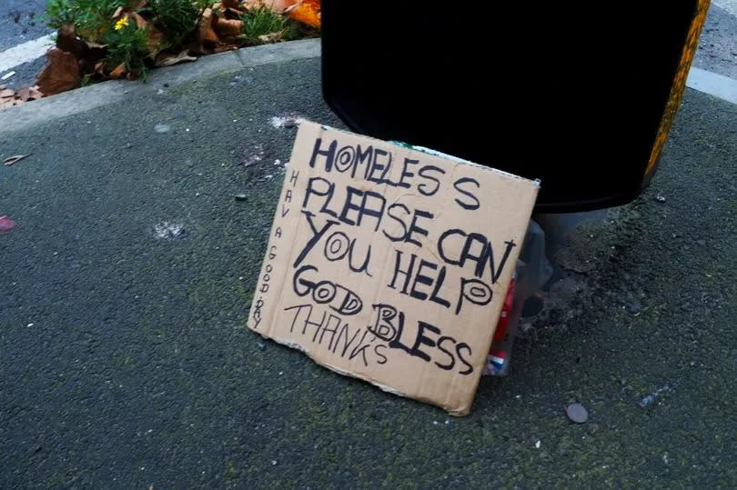 A sign held by another man asking for help, at the junction of Trinity Way and Blackfriars Road -Credit:MEN