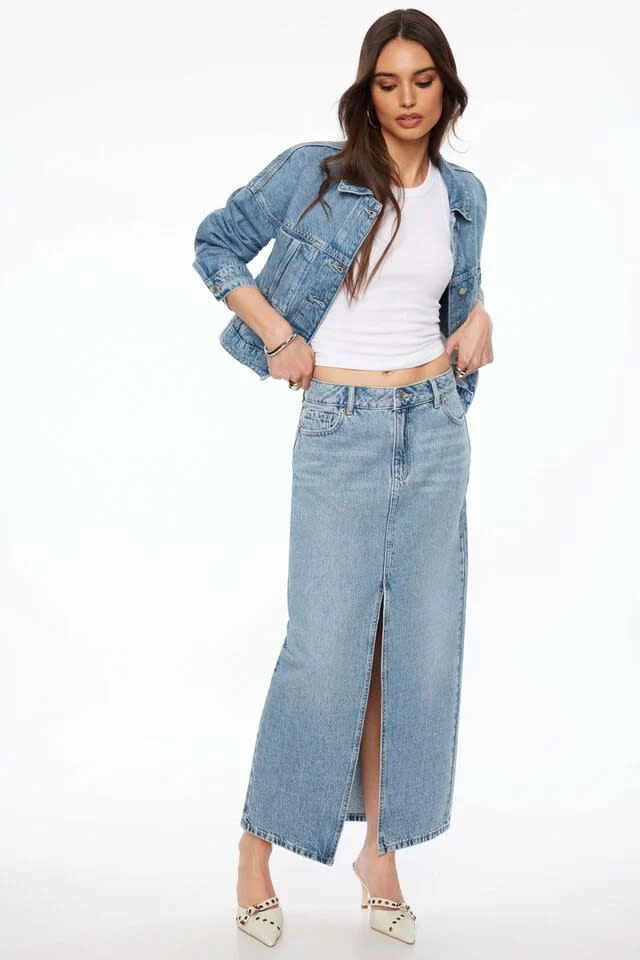 someone wearing the Denim Maxi Skirt from Dynamite 