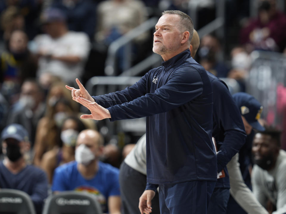 Denver Nuggets head coach Michael Malone directs his players against the Utah Jazz in the first half of an NBA basketball game Sunday, Jan. 16, 2022, in Denver. (AP Photo/David Zalubowski)