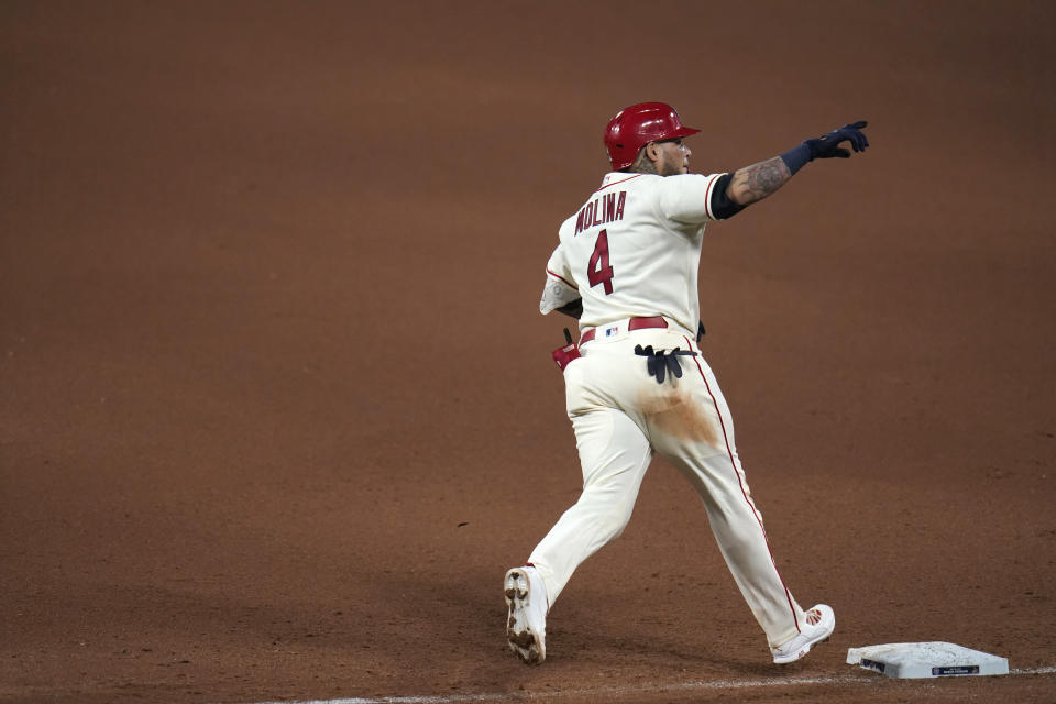 St. Louis Cardinals' Yadier Molina celebrates as he rounds the bases after hitting a solo home run during the seventh inning of a baseball game against the Chicago Cubs Saturday, May 22, 2021, in St. Louis. (AP Photo/Jeff Roberson)