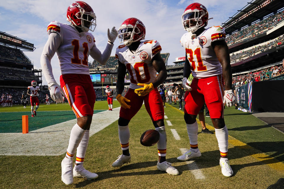 Kansas City Chiefs wide receiver Tyreek Hill (10) celebrates after his touchdown with teammates Demarcus Robinson (11) and KDarrel Williams (31) during the second half of an NFL football game Sunday, Oct. 3, 2021, in Philadelphia. (AP Photo/Matt Rourke)