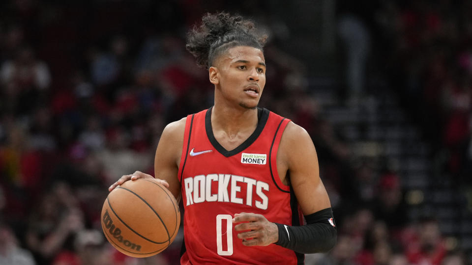 Houston Rockets guard Jalen Green dribbles during the second half of an NBA basketball game against the San Antonio Spurs, Monday, March 28, 2022, in Houston. (AP Photo/Eric Christian Smith)