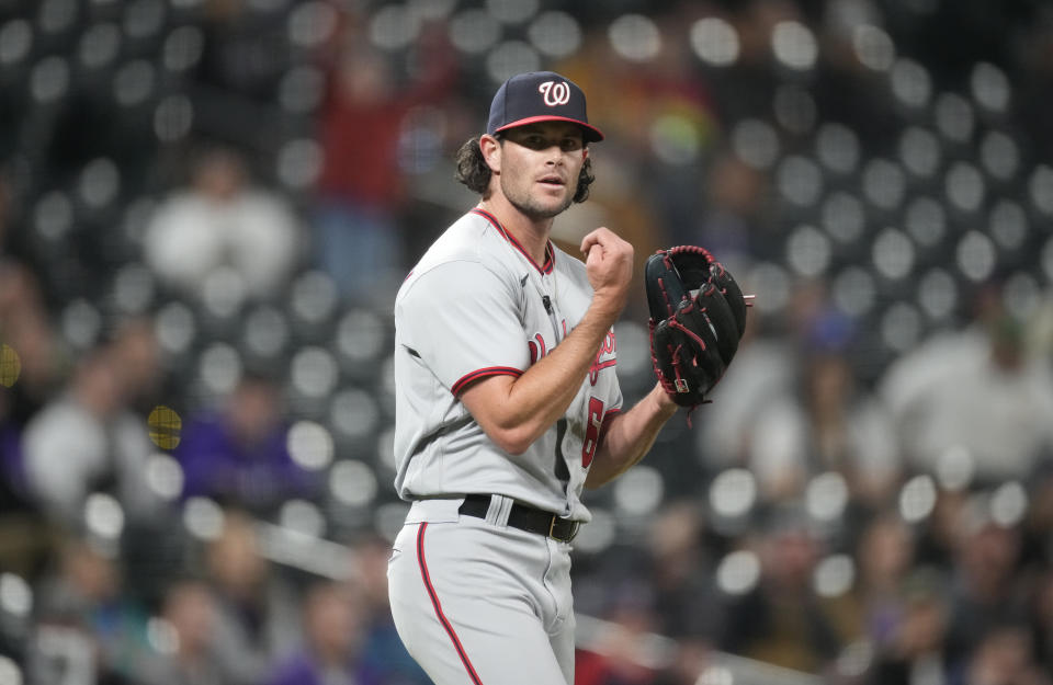 Washington Nationals relief pitcher Kyle Finnegan reacts after getting Colorado Rockies' Kris Bryant to ground out to end the ninth inning of a baseball game Friday, April 7, 2023, in Denver. (AP Photo/David Zalubowski)