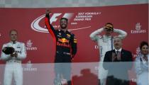 Formula One - F1 - Azerbaijan Grand Prix - Baku, Azerbaijan - June 25, 2017. Red Bull Racing Formula One driver Daniel Ricciardo of Australia celebrates his victory over second placed Mercedes' Valtteri Bottas and third placed Williams' Lance Stroll as Azerbaijan's President Ilham Aliyev and his wife Azerbaijan's Vice-President Mehriban Aliye applaud.