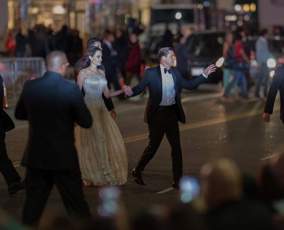 <p>Crossing the street with Brad Pitt at the 2015 premiere of <em>By the Sea.</em></p>