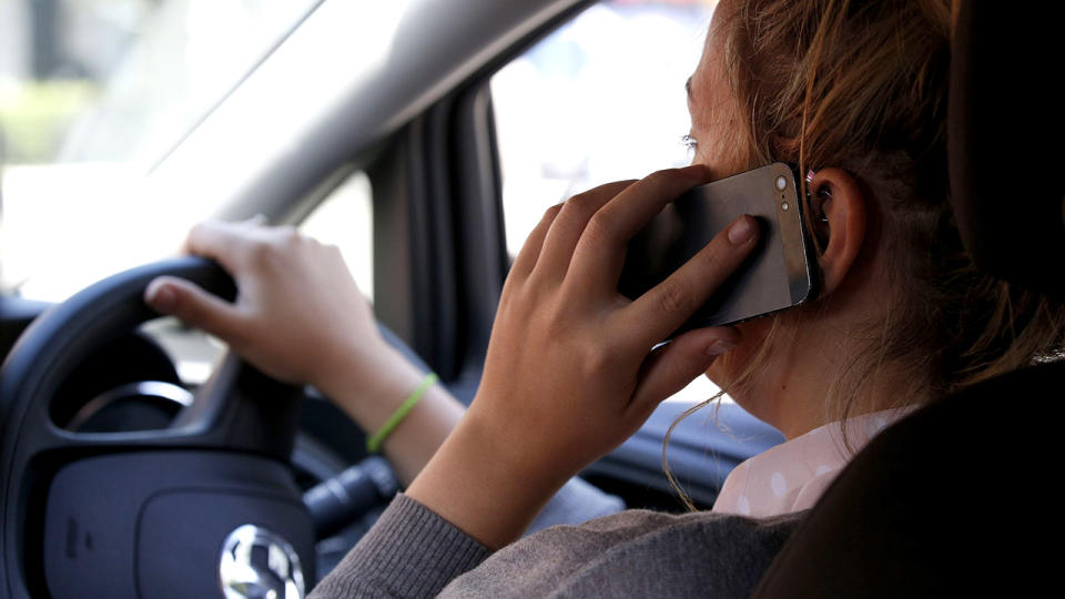 Queensland drivers using mobile phones while driving could soon be fined $1000 in proposed new laws.