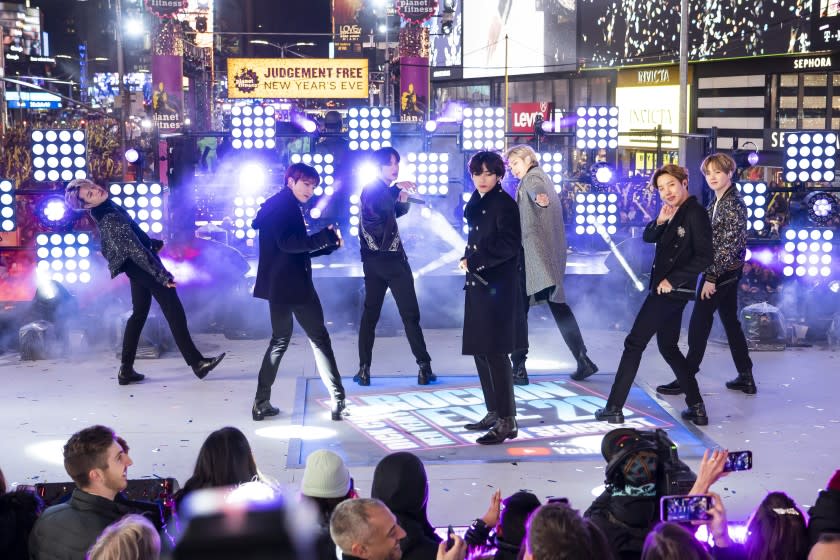 FILE - Members of BTS perform at the Times Square New Year's Eve celebration in New York on Dec. 31, 2019. The South Korean boy band BTS HAS won a leading four awards including best song for "Dynamite" and best group at the MTV Europe Music Awards Sunday, Nov. 8, 2020 while Lady Gaga took home the best artist prize.(Photo by Ben Hider/Invision/AP, File)