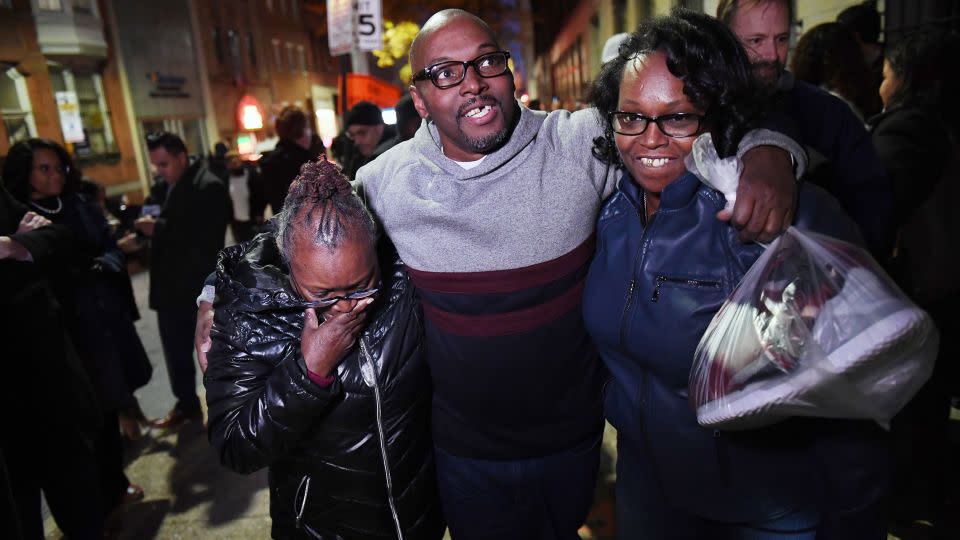 Mary Stewart, left, walks with her son, Andrew Stewart and her daughter, Ulonda Stewart, after his release. - Matt McClain/The Washington Post via Getty Images