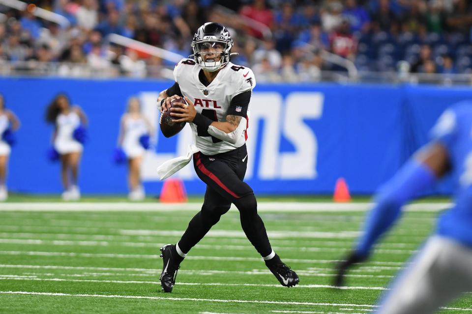 Atlanta Falcons quarterback Desmond Ridder looks for an open receiver against the Detroit Lions in the second quarter of an exhibition game at Ford Field, Aug. 12, 2022.