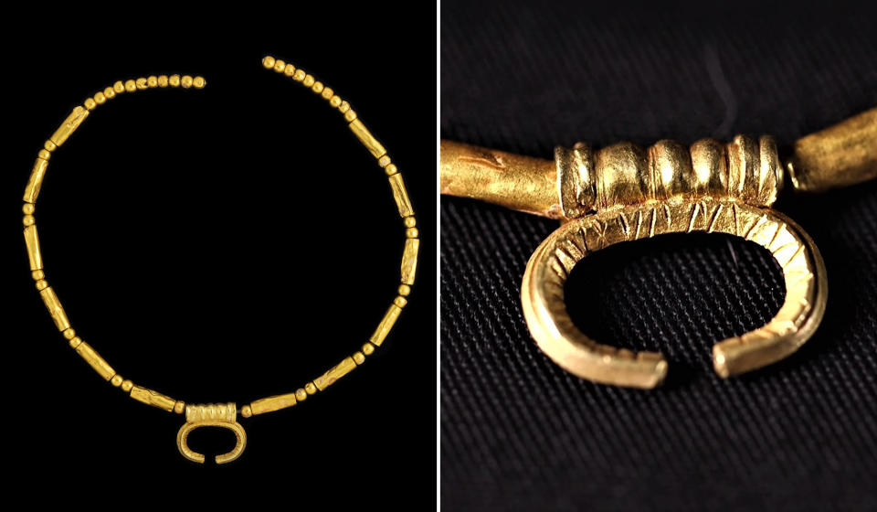 A gold necklace with a crescent moon shape, which would have been positioned on or near the body to protect the spirit in the world to come. (Emil Aladjem  / Israel Antiquities Authority)