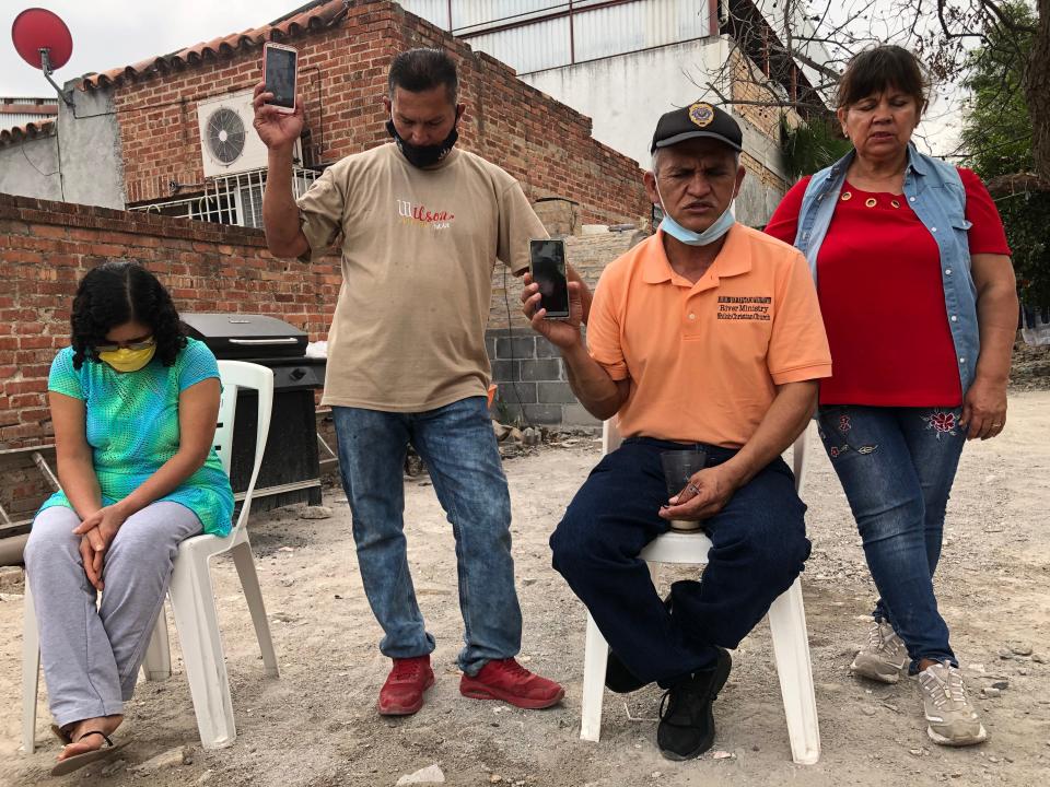 Pastor Lorenzo Ortiz prays with migrants at El Buen Samaritano shelter in Nuevo Laredo, Mexico, just across the Rio Grande from Texas. Many of the migrants have been living at the shelter for more than a year, as they await U.S. immigration hearings.