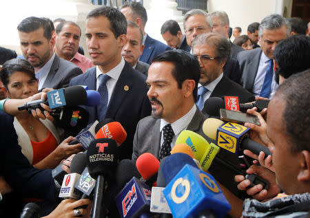 French ambassador to Venezuela Romain Nadal delivers a news conference next to Venezuelan opposition leader Juan Guaido, who many nations have recognized as the country's rightful interim ruler, and accredited diplomatic representatives of the European Union in Caracas, Venezuela February 19, 2019. REUTERS/Marco Bello