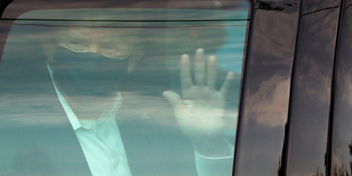 U.S. President Donald Trump waves to supporters as he briefly rides by in the presidential motorcade in front of Walter Reed National Military Medical Center, where he is being treated for coronavirus disease (COVID-19) in Bethesda, Maryland, U.S. October 4, 2020. REUTERS/Cheriss May TPX IMAGES OF THE DAY