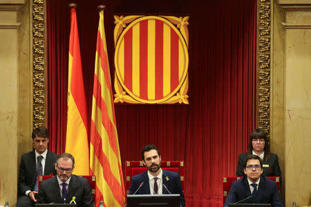 Roger Torrent (C), new Speaker of Catalan parliament, delivers his speech during the first session of Catalan Parliament after the regional elections in Barcelona, Spain, January 17, 2018. REUTERS/Albert Gea