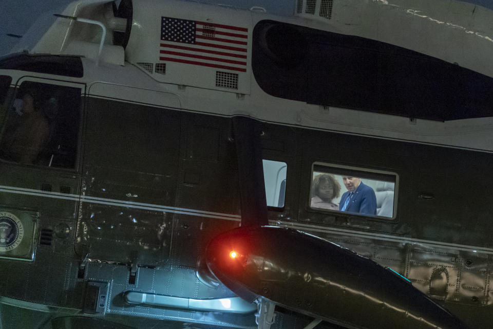 Marine One, with President Joe Biden looking out the window, approaches for landing on the South Lawn of the White House, Thursday, Feb. 9, 2023, in Washington. Biden is returning from Florida. (AP Photo/Alex Brandon)