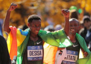 Athletics - New York City Marathon - New York City, New York, U.S. - November 4, 2018 First placed Lelisa Desisa of Ethiopia celebrates alongside second placed Shura Kitata of Ethiopia after the Professional Men's race REUTERS/Brendan McDermid