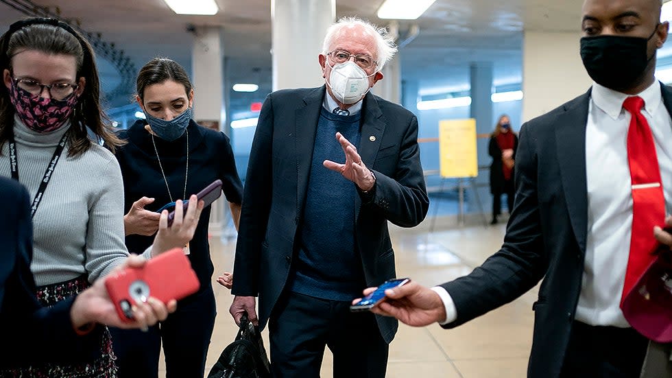 Sen. Bernie Sanders (I-Vt.) speaks to reporters as he arrives to the Capitol for a vote on Wednesday, November 17, 2021.