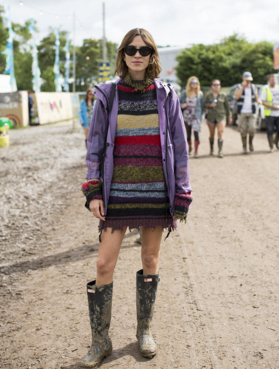 Regular Glasto attendee Alexa Chung looked as effortlessly cool as ever in a knitted dress, raincoat and mud-splattered Hunter wellies. 