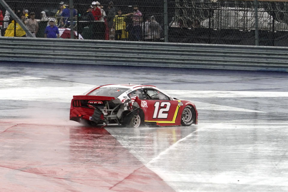 Ryan Blaney (12) spins in Turn 12 during the NASCAR Cup Series auto race at the Circuit of the Americas in Austin, Texas, Sunday, May 23, 2021. (AP Photo/Chuck Burton)