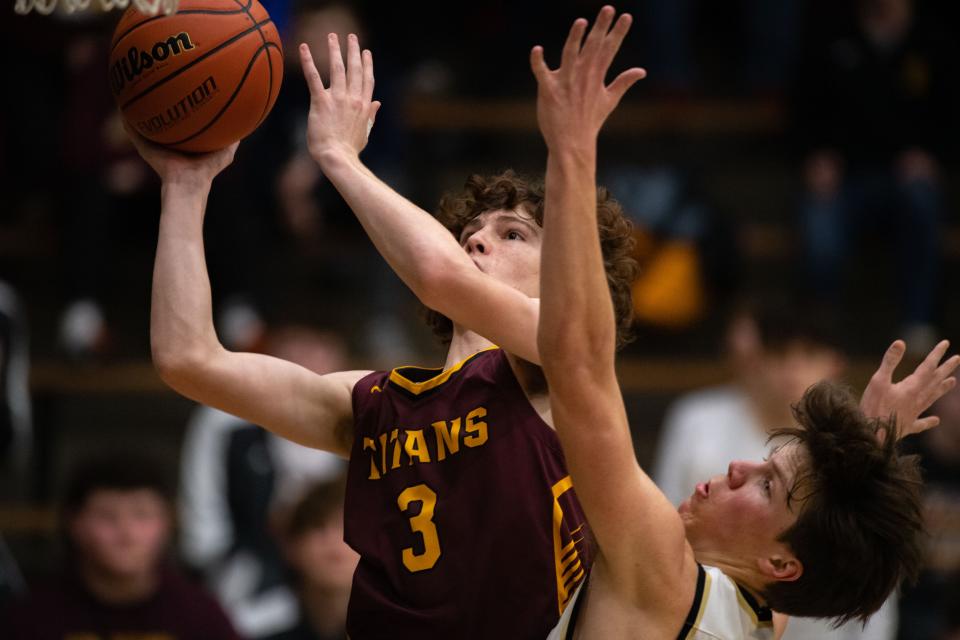 Gibson Southern’s Brodey Lamb (3) leaps for a basket against the Boonville Pioneers during the class 3A boys basketball sectional at Boonville High School on Friday night, March 3, 2023.