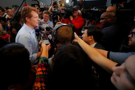 U.S. Rep. Kennedy III answers questions from reporters after announcing his candidacy for the U.S. Senate in Boston