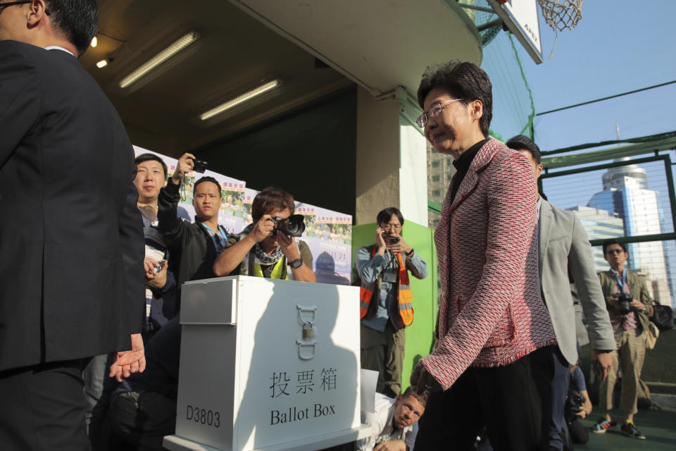 Hong Kong Chief Executive Carrie Lam leaves after casting her ballot at a polling place in Hong Kong, Sunday, Nov. 24, 2019. Voting was underway Sunday in Hong Kong elections that have become a barometer of public support for anti-government protests now in their sixth month. (AP Photo/Kin Cheung)
