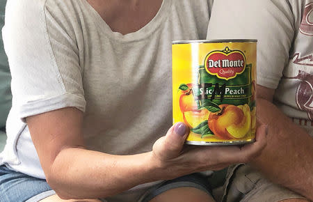 Eileen O’Brien shows the canned peaches that she delivered, to underscore her support for impeachment, to the office of her U.S. House of Representative, at her home in Clearwater, Florida, U.S., April 18, 2019. REUTERS/Letitia Stein