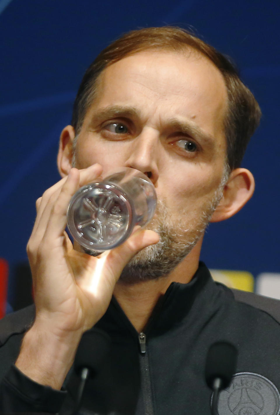 PSG coach Thomas Tuchel drinks water during a media conference at Stade des Princes stadium in Paris, Tuesday, march 5, 2019. PSG will play Manchester United in a Champions League match on Wednesday march 6. (AP Photo/Michel Euler)