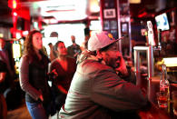 <p>Patrons at Ace’s Bar watch a television broadcast of former FBI Director James Comey testify before the Senate Intelligence Committee on June 8, 2017 in San Francisco. (Justin Sullivan/Getty Images) </p>