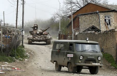 A tank of the self-defense army of Nagorno-Karabakh moves on the road in the village of Talish April 6, 2016. REUTERS/Staff