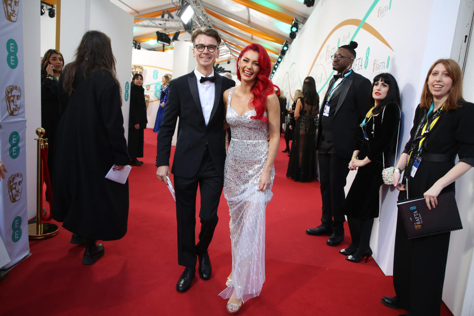 Joe Sugg looks smart in tux and Dianne Buswell sparkles in sequins at BAFTA