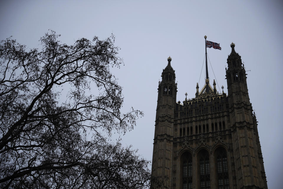 FILE - In this file photo dated Friday, Jan. 1, 2021, a British Union flag flies atop the Houses of Parliament in London, on the morning after the U.K. fully left the European Union. The British government said Wednesday March 24, 2021, the national flag should be flown every day on all public buildings, the latest move in an increasing embrace of the Union flag. (AP Photo/Matt Dunham, FILE)