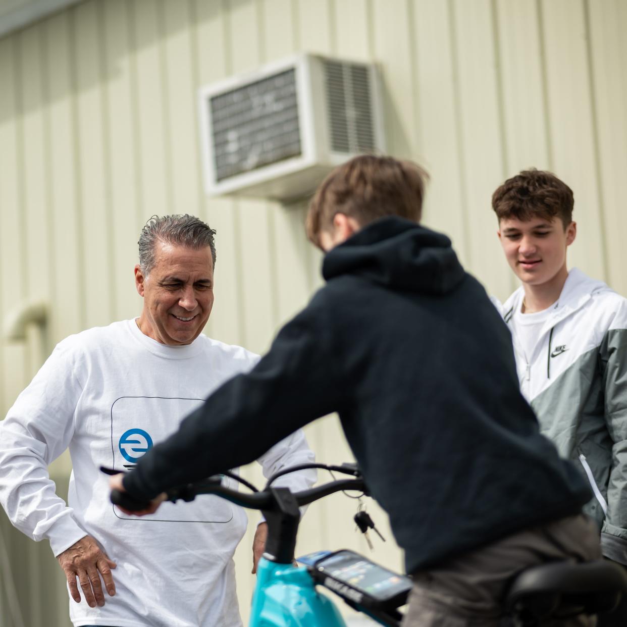 From left: Daniel Trevisani, Vincent Trevisani and Daniel Trevisani Jr. check out the electric bikes at the new eBliss Experience Center in Clinton, NY on Saturday, April 27, 2024.