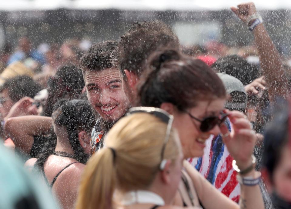 Fans get sprayed with a fire hose in front of the Octane stage at the 2022 edition of Welcome to Rockville at Daytona International Speedway. The four-day heavy-metal music fest returns May 18-21.