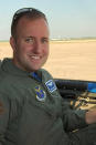 In this undated photo provided by the U.S. Air Force, fallen Air Force Capt. Ryan Phaneuf, 30, of Hudson, N.H., is seated in an aircraft. The Pentagon on Wednesday, Jan. 29, released the names of two Air Force officers killed in the Monday, Jan. 27, 2020 crash of their Bombardier E-11A electronic surveillance plane, in Ghazni Province, in eastern Afghanistan. An American official added that there were no indications so far the plane had been brought down by enemy fire. (U.S. Air Force Photo via AP)