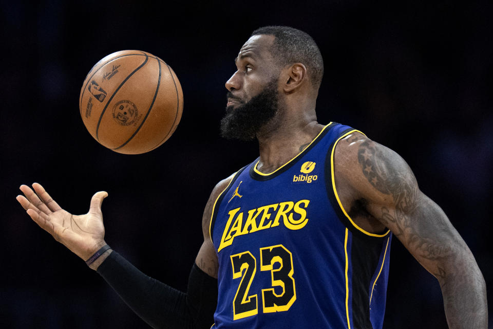 Los Angeles Lakers' LeBron James grabs the ball during the second half of an NBA basketball game against the Philadelphia 76ers Friday, March 22, 2024, in Los Angeles.(AP Photo/Jae C. Hong)