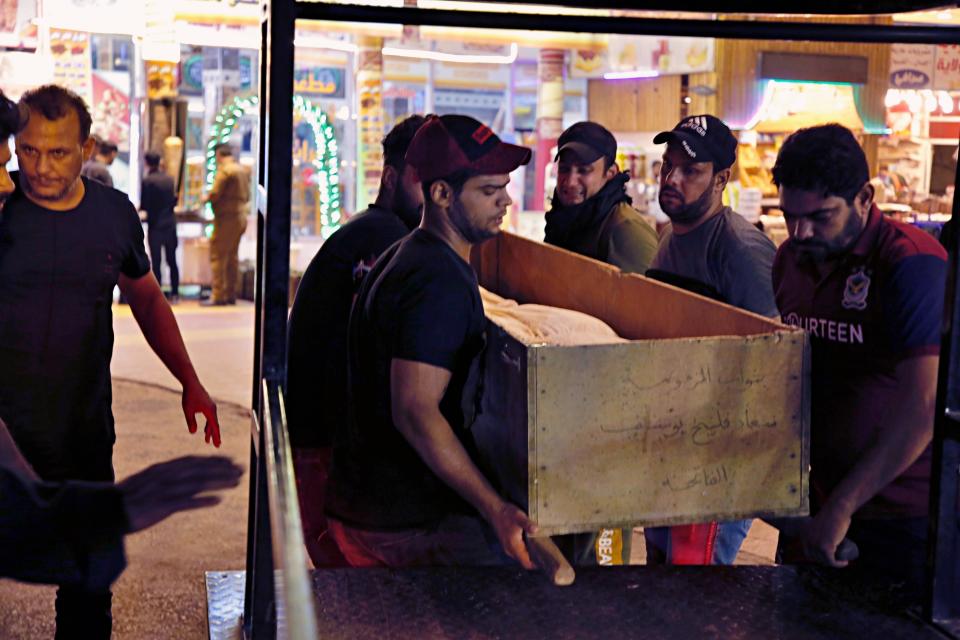 Mourners carry the coffin of Saleh Ahmed, 27, a protester killed during anti-government demonstrations in Najaf, Iraq, Monday, Oct. 28, 2019. (AP Photo/Anmar Khalil)