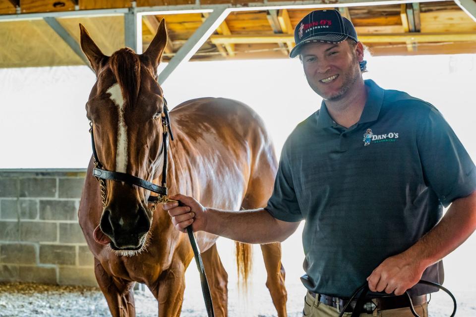 Kentucky Derby winner Rich Strike with Dan-O's founder Dan Oliver.