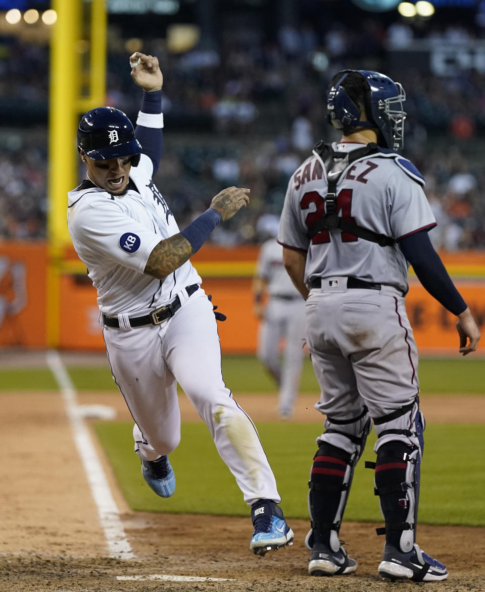 Detroit Tigers shortstop Javier Baez scores on a single by designated hitter Miguel Cabrera during the eighth inning of a baseball game against the Minnesota Twins, Saturday, July 23, 2022, in Detroit. (AP Photo/Carlos Osorio)