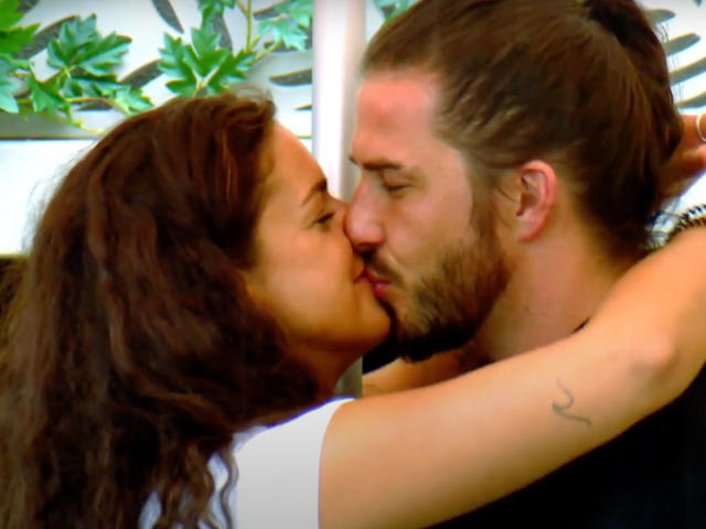 Drew is pictured kissing Sam, on the set of Big Brother