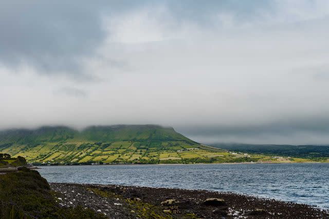 <p>Simon Watson</p> The shoreline between Carnlough and Waterfoot, part of Portia Woods’s Toast the Coast tour.