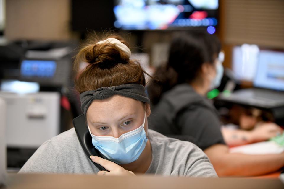 Medical assistant Abby Ruggles juggles calls into the Northeast Ohio Women's Center in Cuyahoga Falls on Friday as confusion from patients sets in over the U.S. Supreme Court decision.