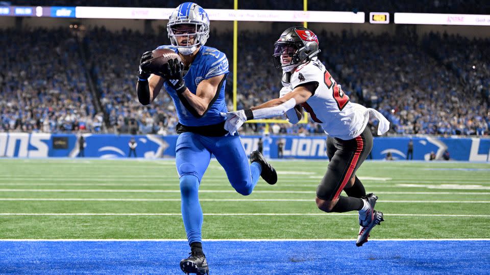 St. Brown catches a touchdown against Tampa Bay Buccaneers cornerback Zyon McCollum during the second half of their NFC divisional round playoff game. - Lon Horwedel/USA TODAY Sports/Reuters