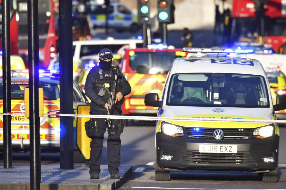 Armed police at the scene of an incident on London Bridge in central London following a police incident, Friday, Nov. 29, 2019. British police said Friday they were dealing with an incident on London Bridge, and witnesses have reported hearing gunshots.  The Metropolitan Police force tweeted that officers were “in the early stages of dealing with an incident at London Bridge.” (Dominic Lipinski/PA via AP)