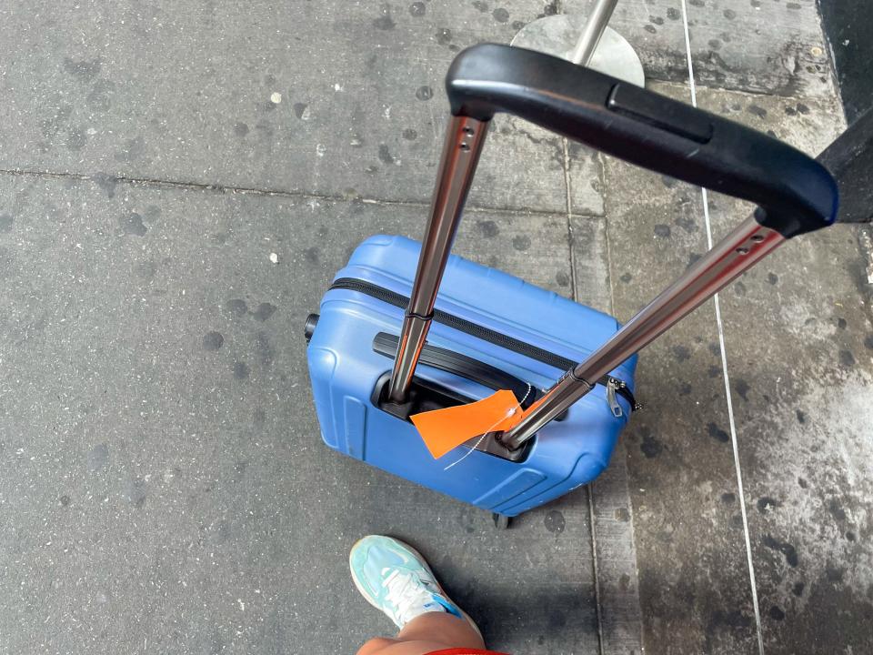 My luggage next to my foot.